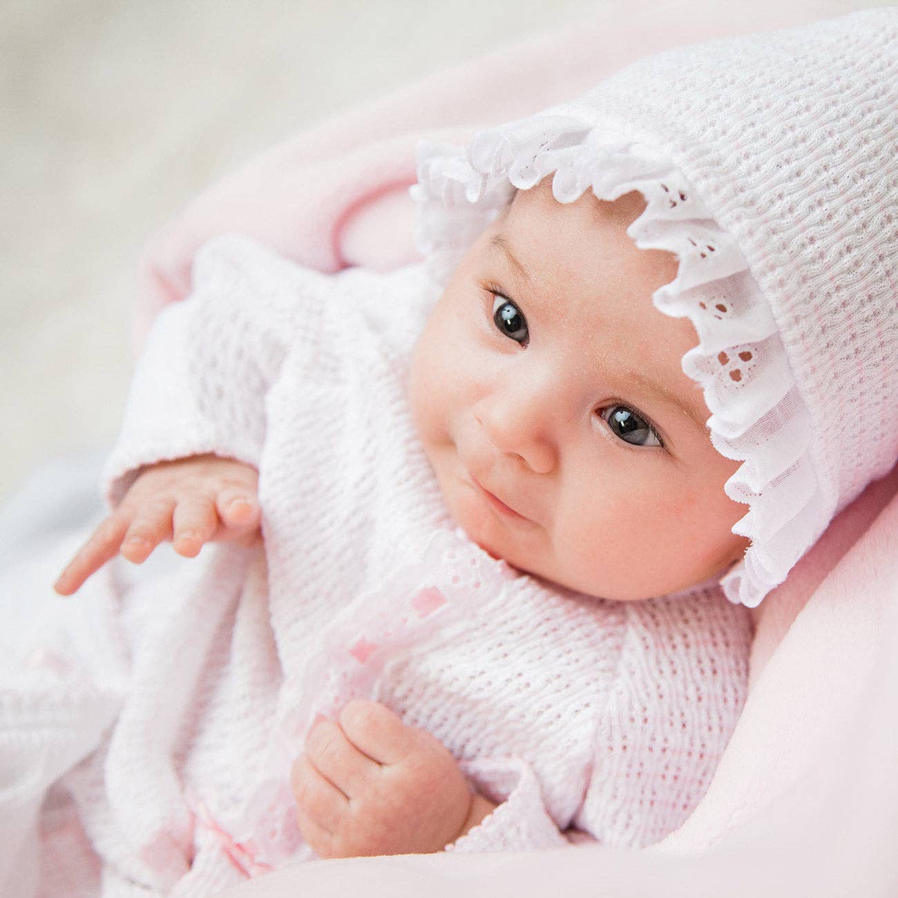 Paty Knit White Bonnet w/ Eyelet Trim and Ribbon Tie