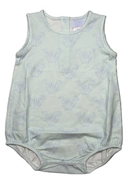 Light green baby romper with shell pattern on a textured surface
