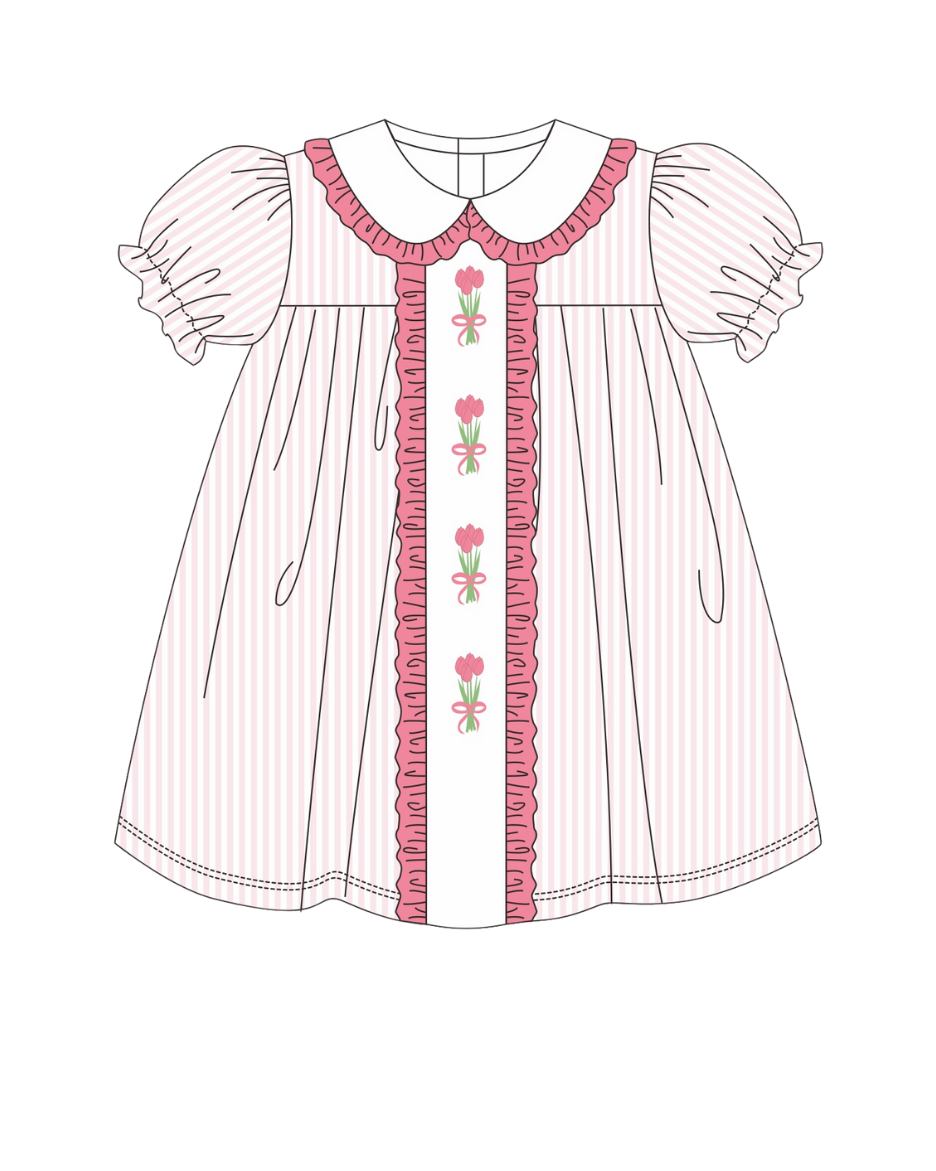 Children's dress with floral embroidery on a white background