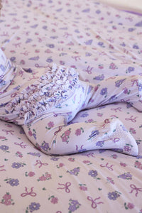 Ribbon & Roses Ruffle Zipper Footie | Purple