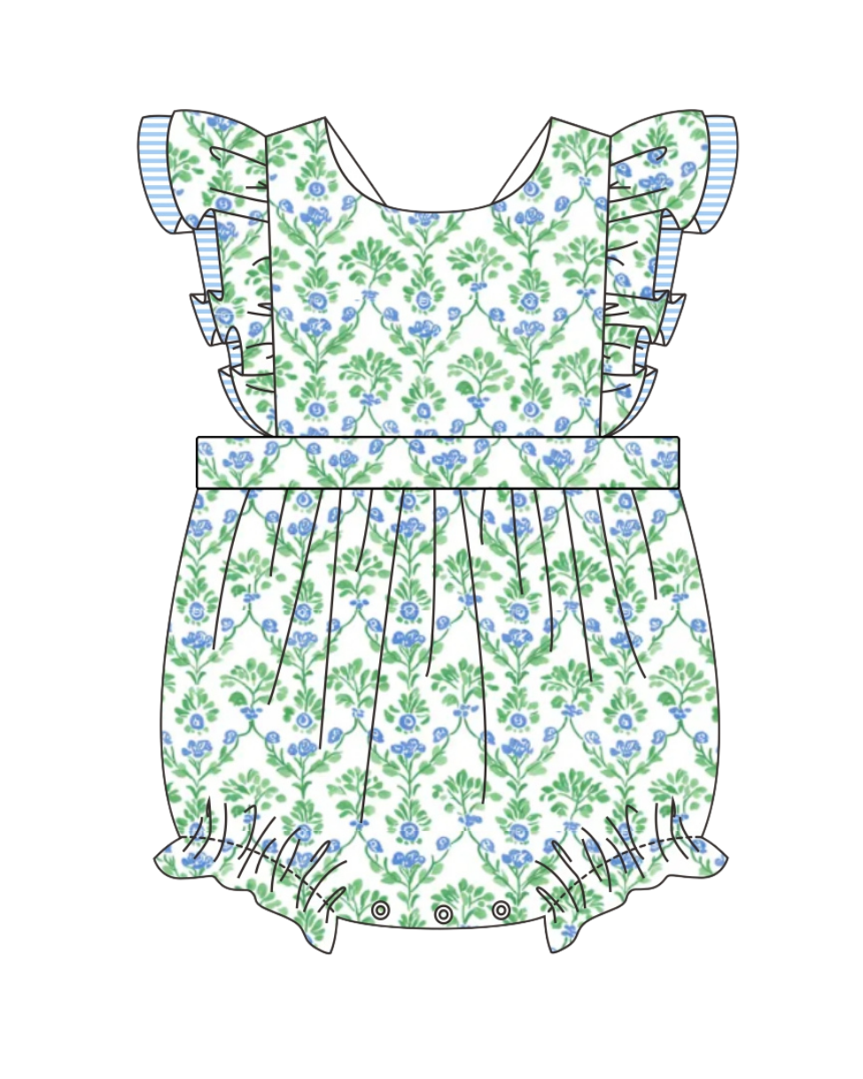 Children's floral dress with ruffled details on a white background